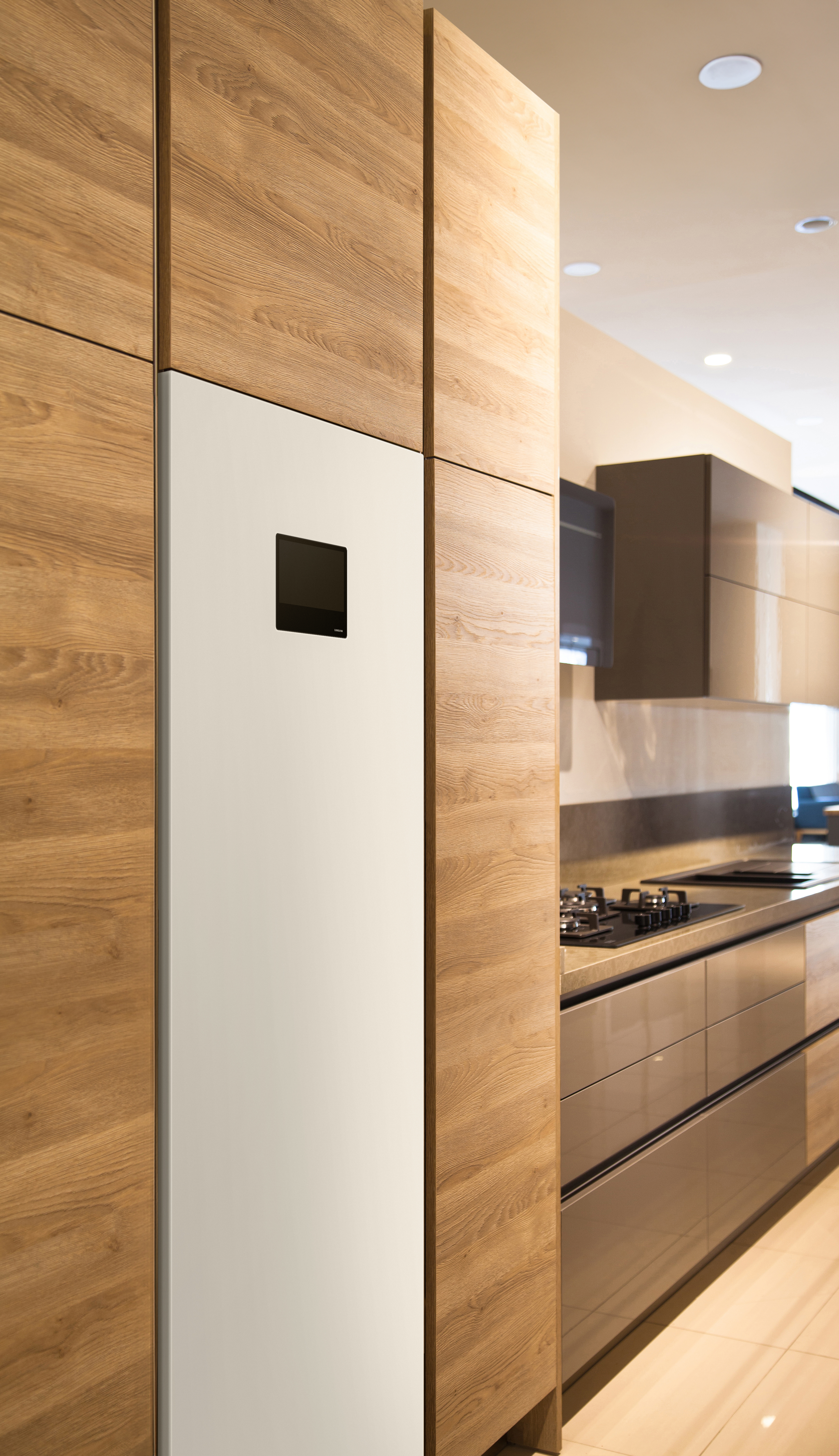 Interior of luxurious modern kitchen equipment, grey and oak cabinets